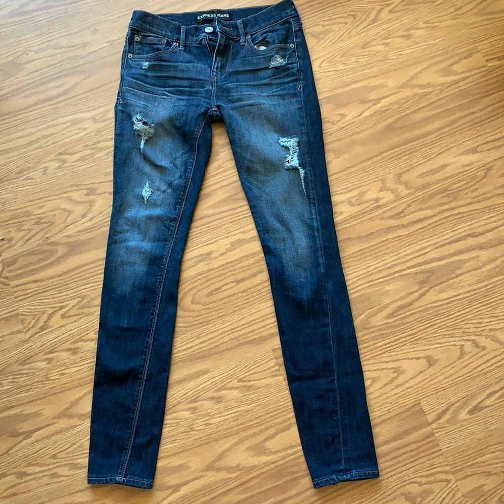 Express mid rise legging jeans. Slightly distressed look
